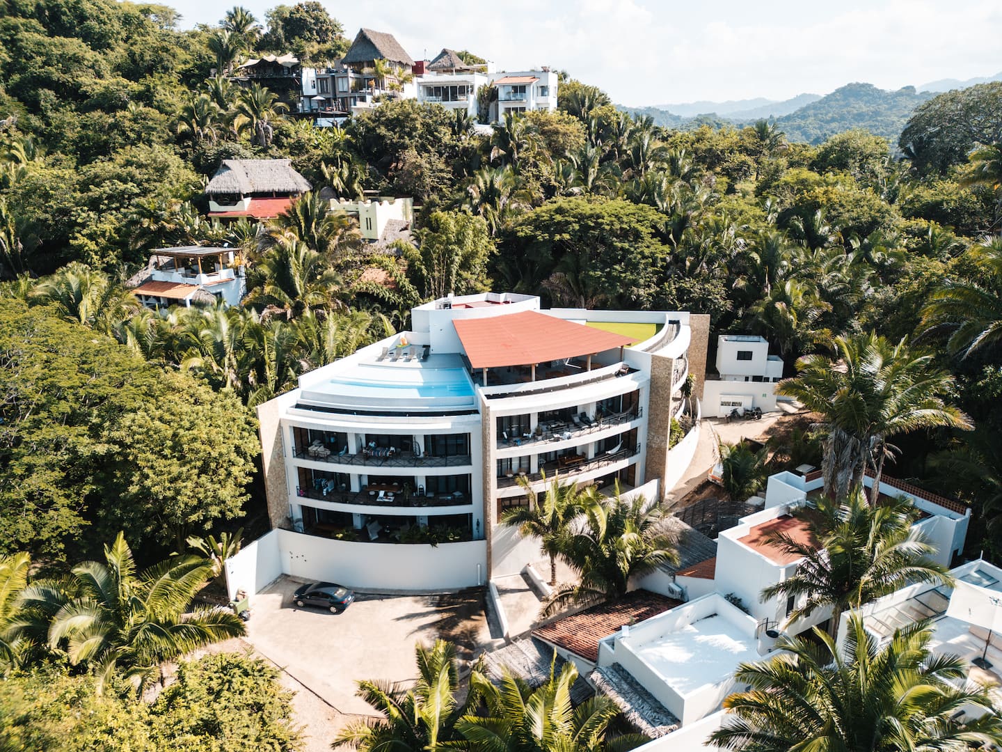 The property laid out from above, pool deck and building together, so you know exactly what you're booking.