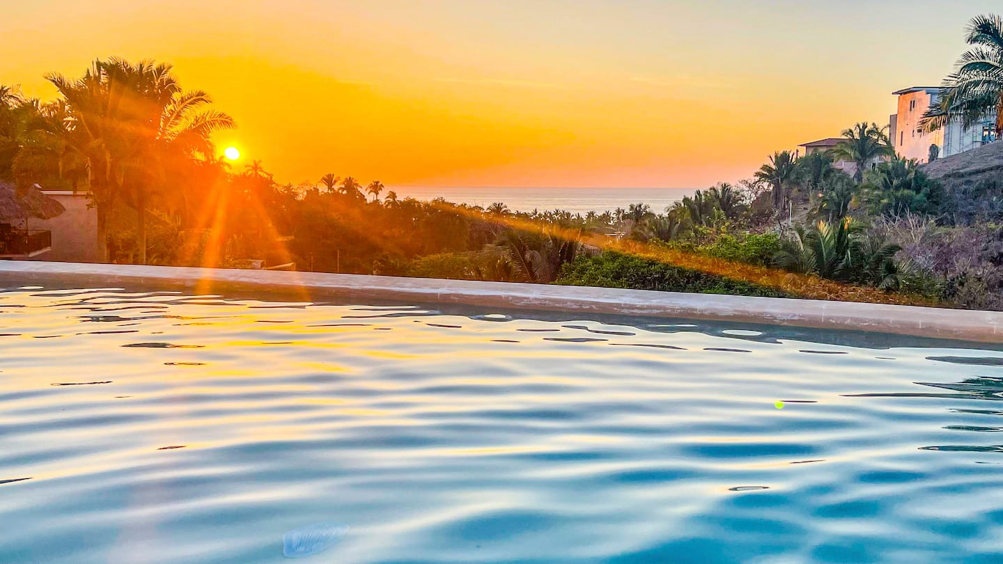Golden hour turns the water gold, worth timing your swim for.