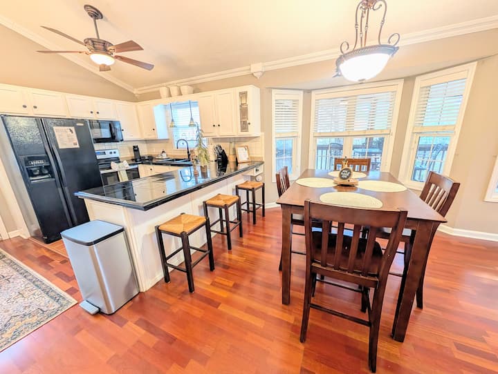 Full kitchen with island and dining area