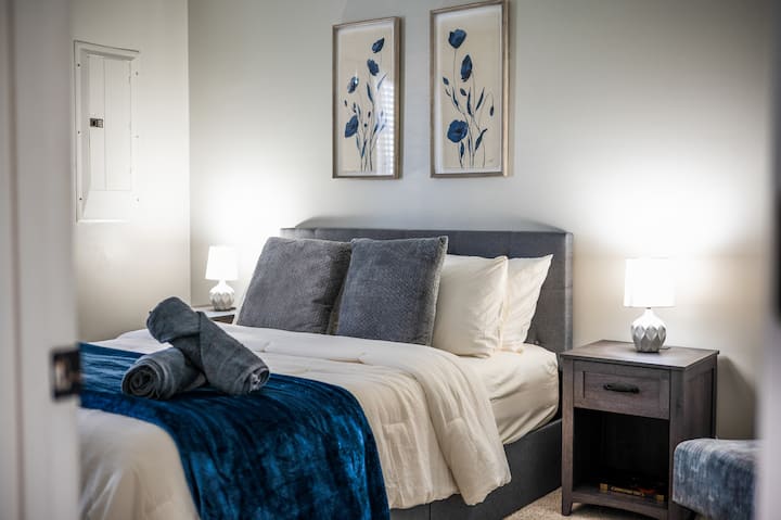 A comfortable main-level queen bedroom featuring memory foam mattress with premium bedding.  Perfect for anyone needing main level living offering  comfort and easy accessibility.