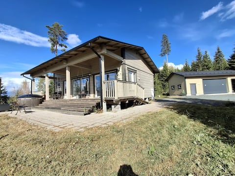 Log house with a balcony and lake views