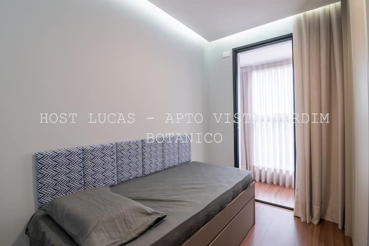 Habitación secundaria con cama individual y cama auxiliar.