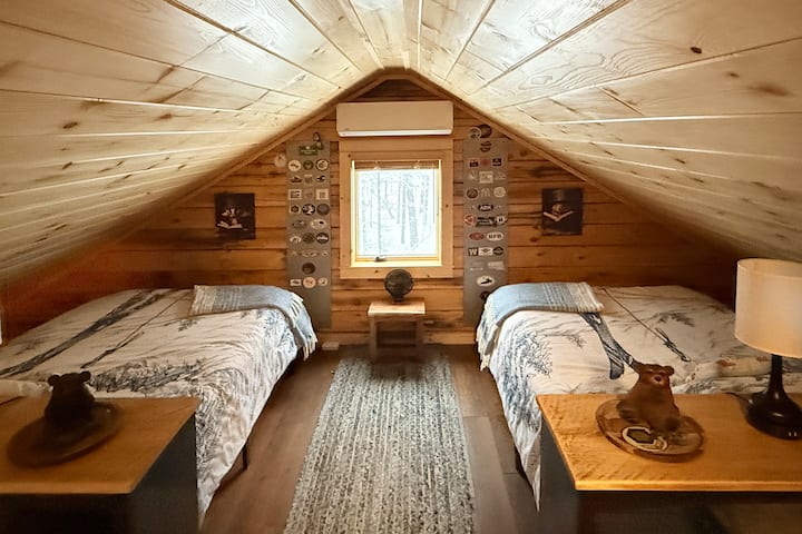 The loft with two full size beds. My favorite view and cozy spot in the whole cabin.