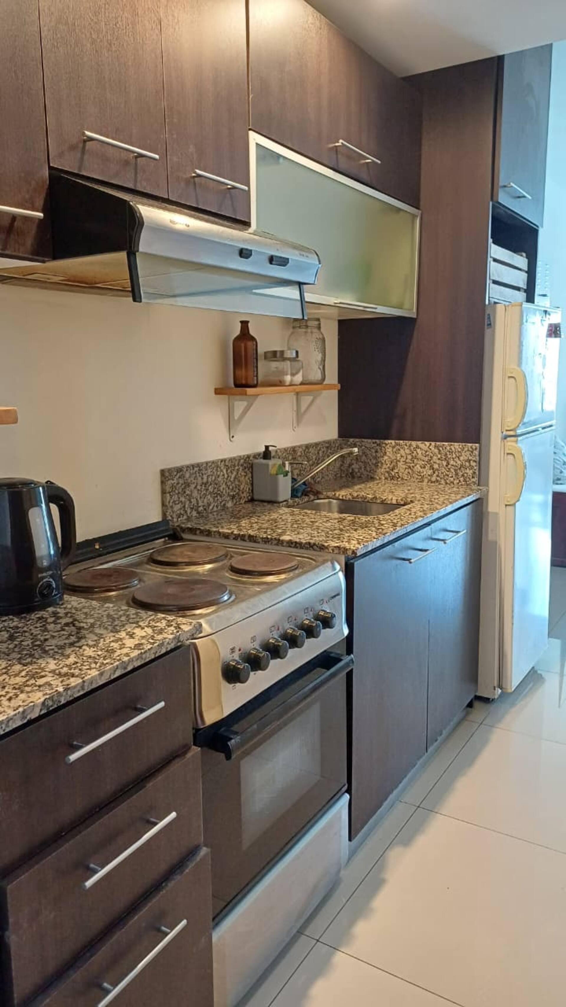 Large studio apartment with balcony overlooking a major avenue