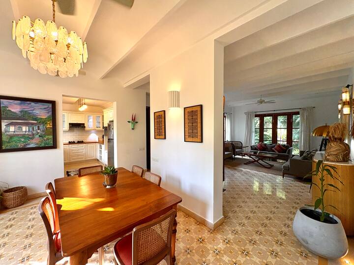 The space seamlessly connects to the kitchen and living area, creating an open and airy flow throughout the home.