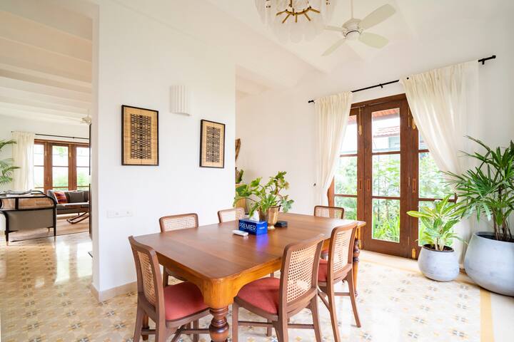 This beautiful dining area features a spacious layout and abundant natural light, designed for comfo