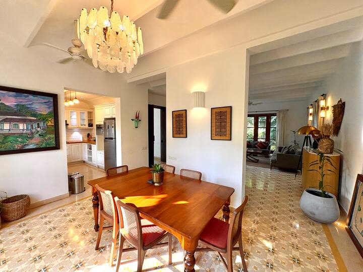 Gather and dine in a warm, elegant dining space designed for comfort and connection. This beautifully arranged area features a solid wooden dining table with comfortable seating, making it perfect for shared meals, conversations.