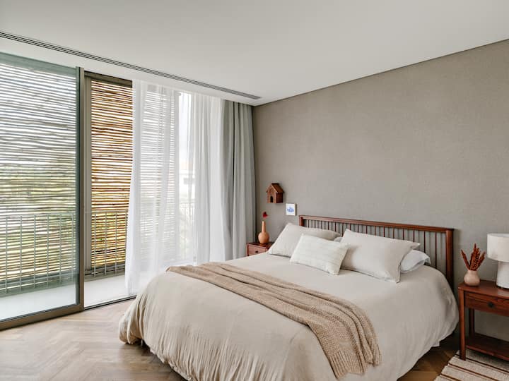 Two guest bedrooms with balcony, working desk, air conditioning, mosquito net, queen size bed and different pillow heights.