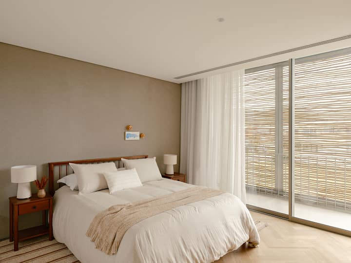 Two guest bedrooms with balcony, working desk, air conditioning, mosquito net, queen size bed and different pillow heights.