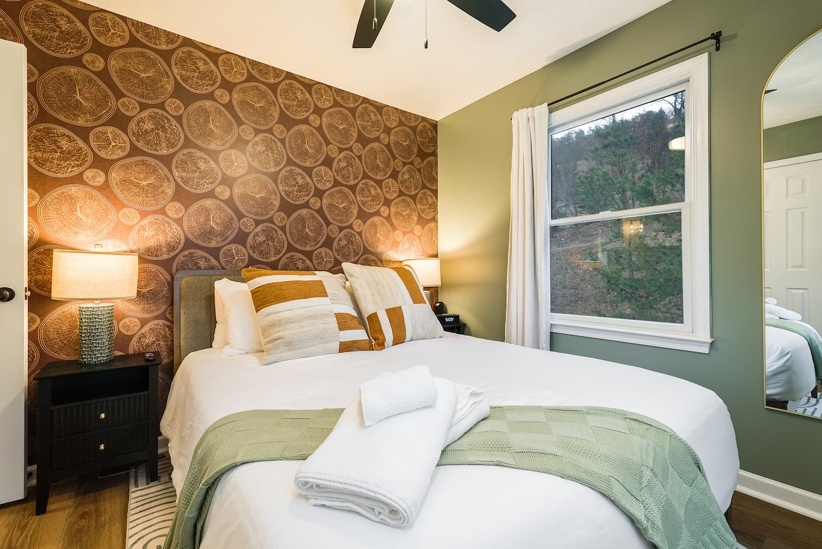 Bedroom with a window to the woods