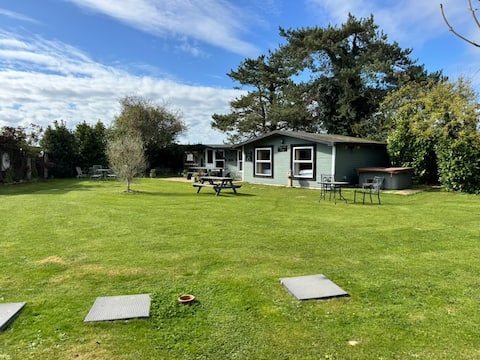 Twin Lodges • Sleeps 18 • 2 Hot tubs & Games room