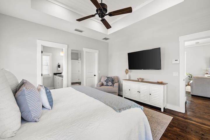 You'll feel pampered in this serene king suite with ensuite, smart TV, vaulted ceiling fan, and your own private balcony