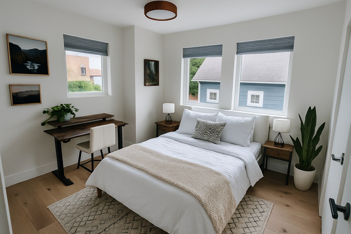 Dormitorio secundario con colchón de espuma viscoelástica, cama completa, persianas opacas y un espacio de trabajo dedicado. El escritorio y la silla son ajustables para estar de pie o sentado. 