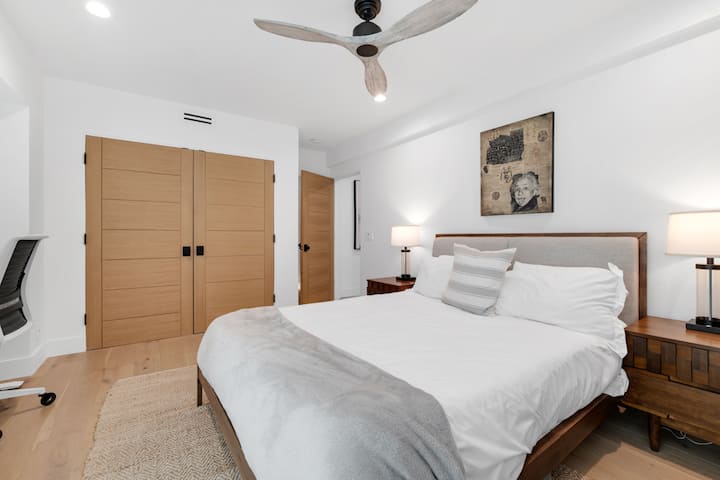 Cozy retreat with soft lighting and plush bedding for restful sleep.