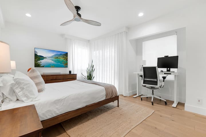 Spacious bedroom with a calm ambiance and thoughtful touches.