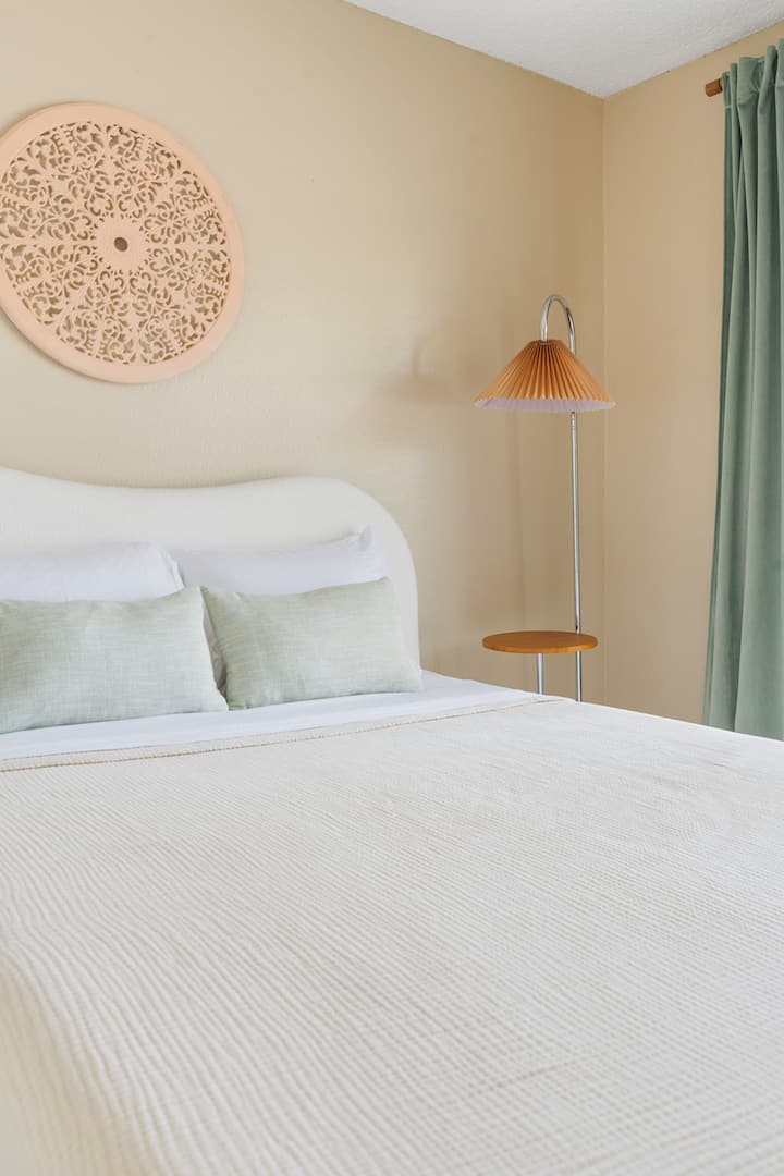 Bedroom 2 has a firm memory foam full bed with a twin trundle, a closet with two luggage racks and plenty of hangers, as well as room-darkening curtains for a restful sleep.