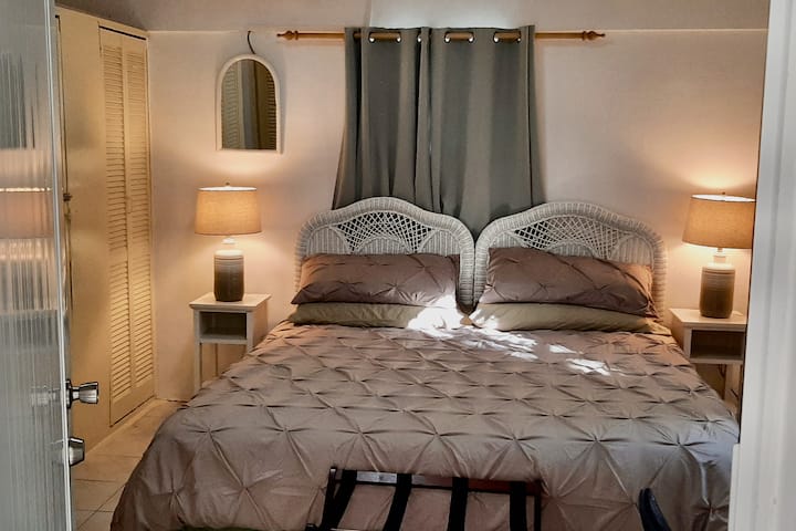 This bedroom is directly accessible from the street-side porch.