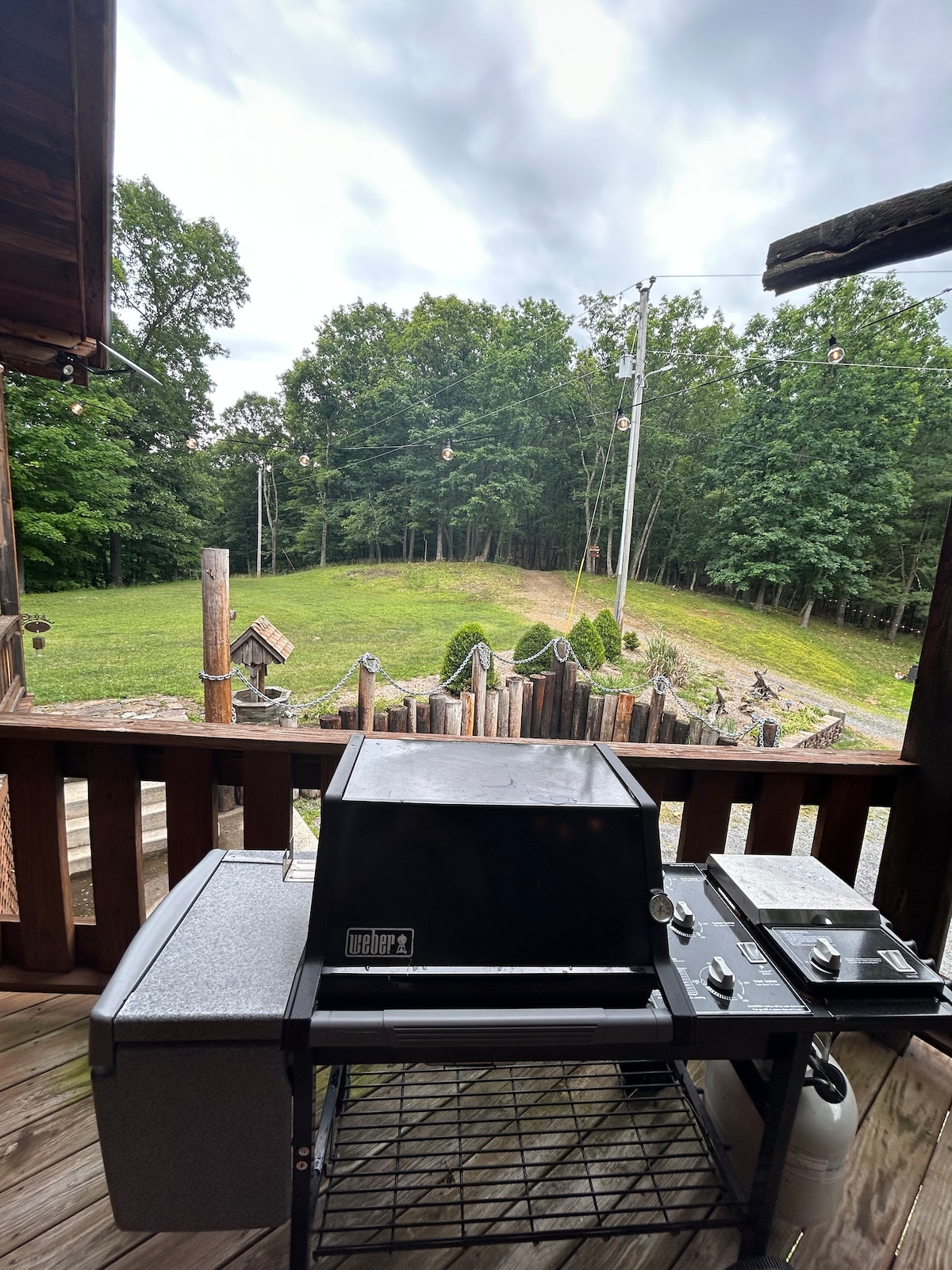 Outdoor BBQ Charcoal Grill on Gravel Lawn