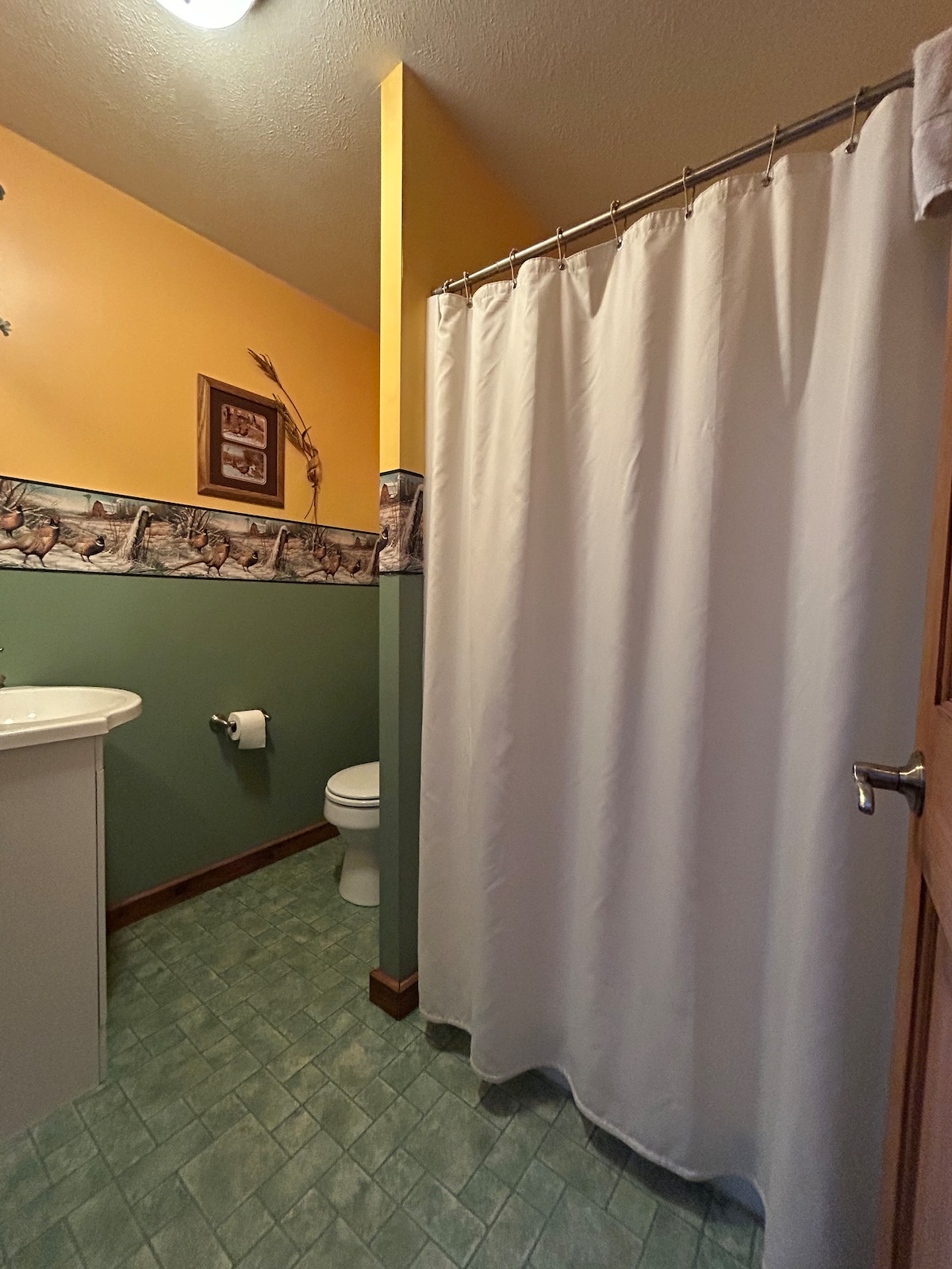 Full Bathroom 1 — Tub, Shower & Pedestal Sink
