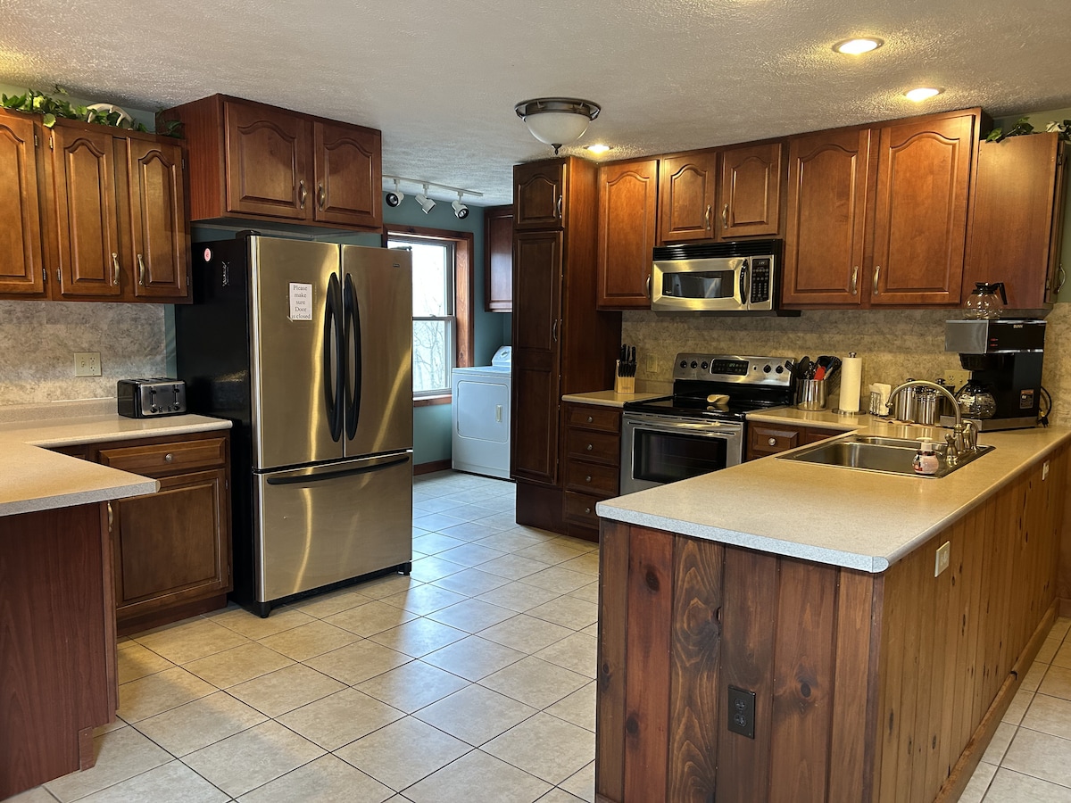 Kitchen with Stainless Refrigerator, Range & Microwave