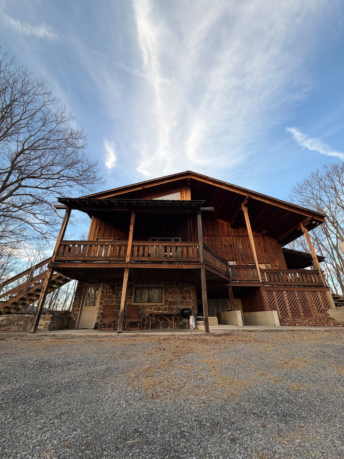 Daytime Front Exterior & Spacious Gravel Driveway