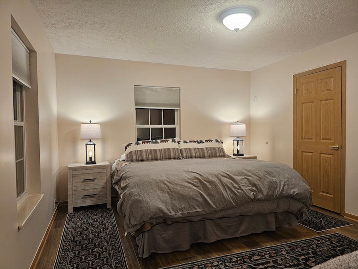King-size bed, Walk-in Closet and ensuite bathroom with double sinks.