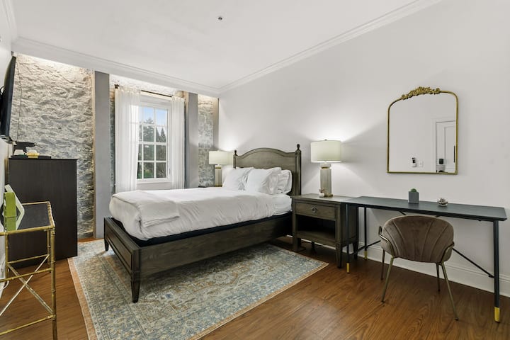 Private room with soft natural light and a comfortable bed.