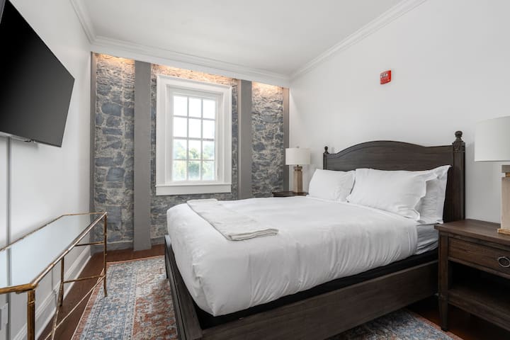 This is the private room you will be renting featuring stone-accented walls, natural light, and a peaceful atmosphere.