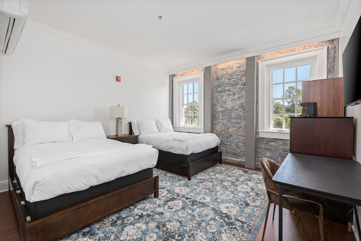 This is the private room you will be renting featuring two comfortable double beds and bright natural light.