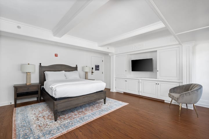 This is the private room you will be renting featuring a comfortable queen bed, built-in cabinetry, and a bright open layout.