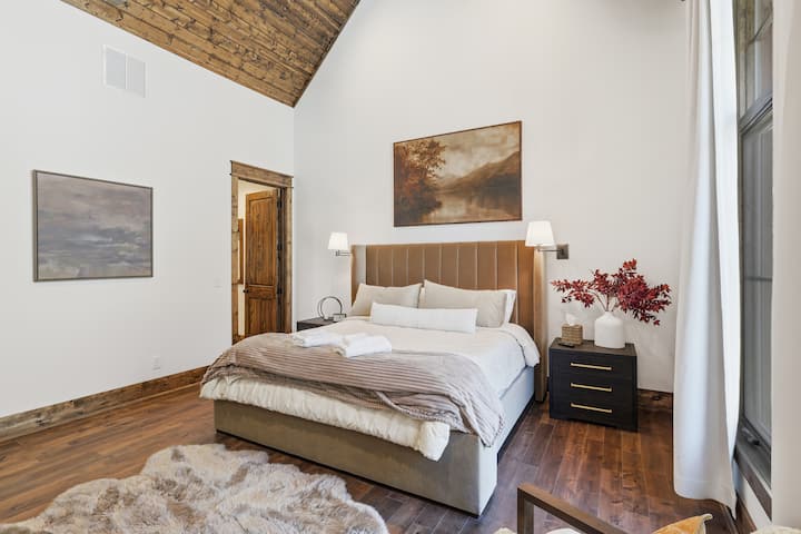 Wake up surrounded by mountain serenity. This primary bedroom features vaulted ceilings, cozy bedding, and tranquil décor. Step outside or simply relax inside — either way, it’s a peaceful escape designed for deep, restorative rest.