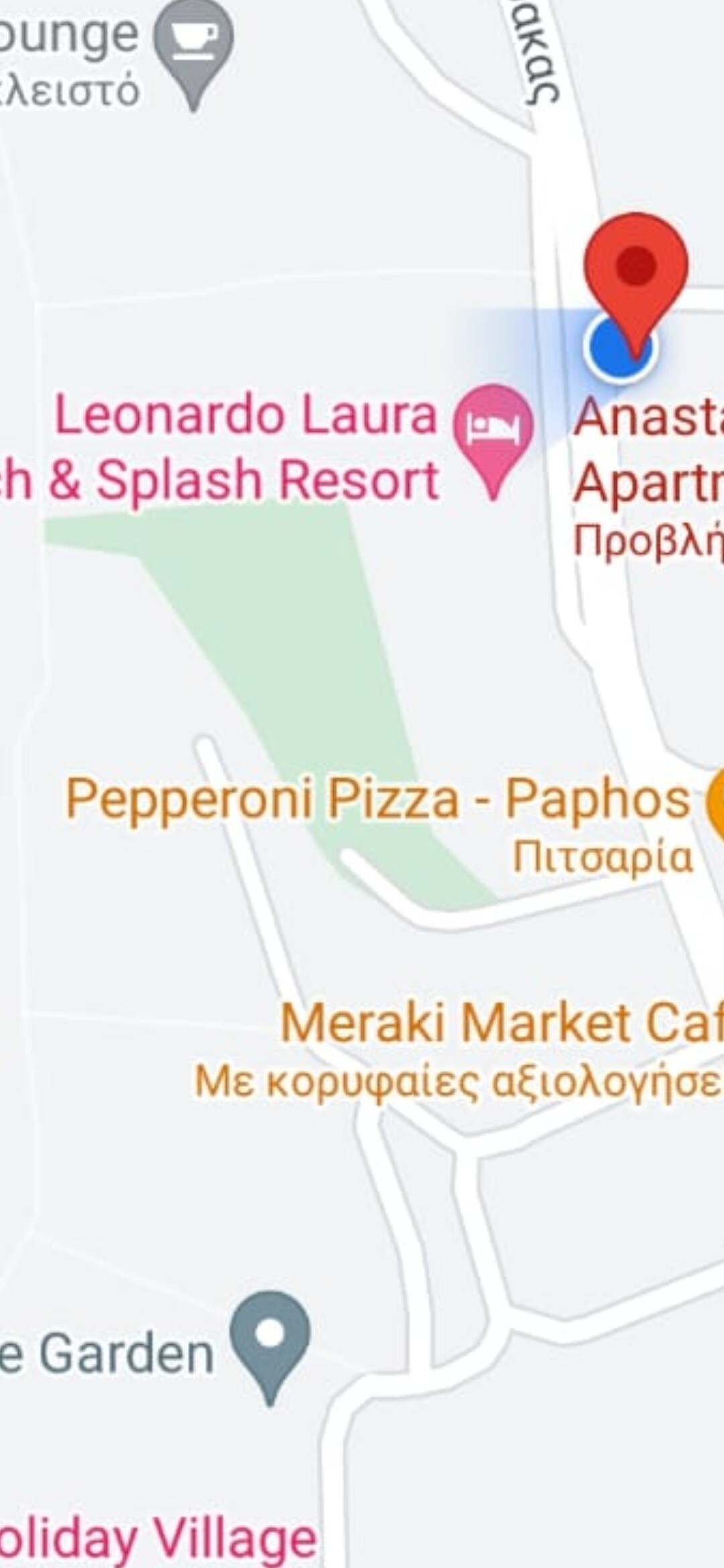 A map view showcasing nearby amenities, including a pizza restaurant and a market cafe. The location of Anastasia Apartments is indicated in relation to the Leonardo Laura Beach & Splash Resort, highlighting accessible dining options within the vicinity.