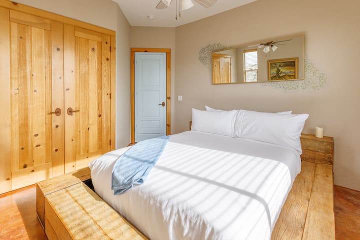 Bedroom 4 - a cozy queen room with natural textures and calming tones.