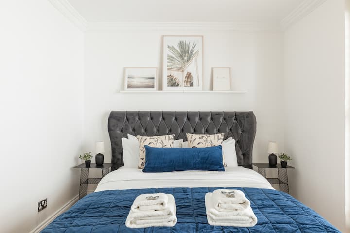 Bedroom 2: This comfortable room is restful and well-appointed, offering a King-sized bed and large fitted wardrobes for plenty of storage.
