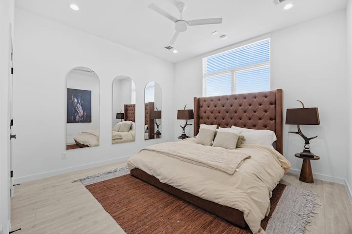 master bedroom with king bed & private bathroom