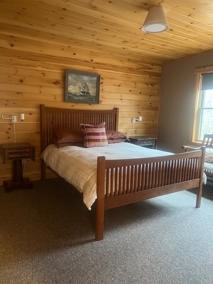 Bedroom 1 is off the kitchen with a bureau for plenty of storage. Queen bed with 100% white cotton bedding and extra blankets + pillows. 