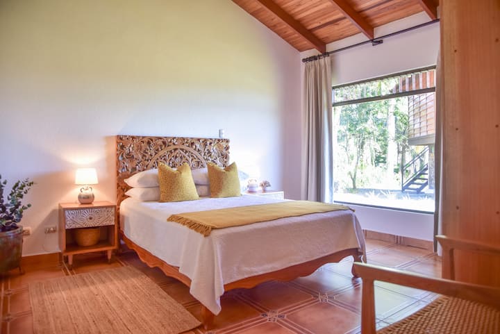 Bedroom offers a Queen bed with adjacent full bathroom. Soothing linens for a peaceful nighttime sleep.  