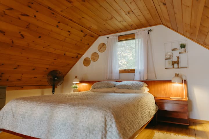 Loft area with queen bed.