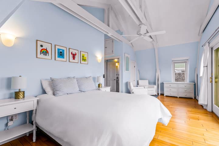 Relax in the master bedroom’s plush bed with premium linens and stunning views.
