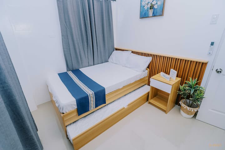 2nd Bedroom
Featuring a cozy double bed plus a pull-out bed, perfect for a family of 3. Comfort and convenience all in one! ✨