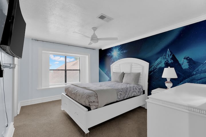 Comfortable queen bedroom designed for restful sleep, with an attached bathroom.