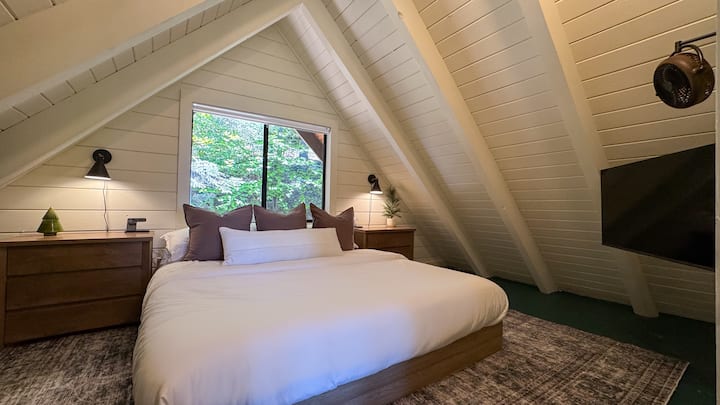 The A-Frame bedroom (upstairs) features a King-size bed, and stunning views of Lake Arrowhead & Lake Arrowhead Village.