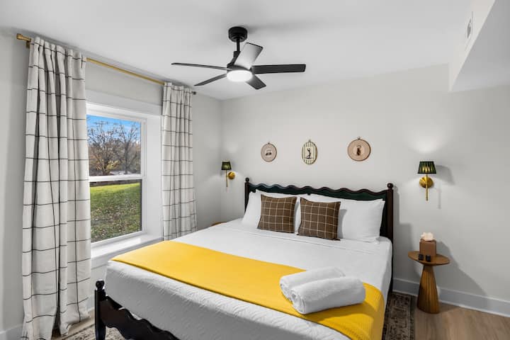 Lower level Primary Bedroom with luxury hybrid king bed, luxury linens & pillows.