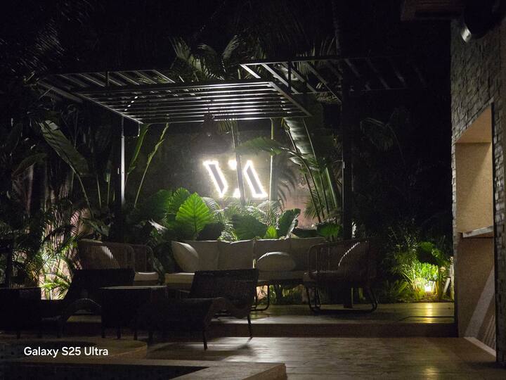 Unwind in our beautifully designed pool side open sitting area, featuring a comfortable sofa setup for up to 7 guests-perfect for relaxing with family and friends.