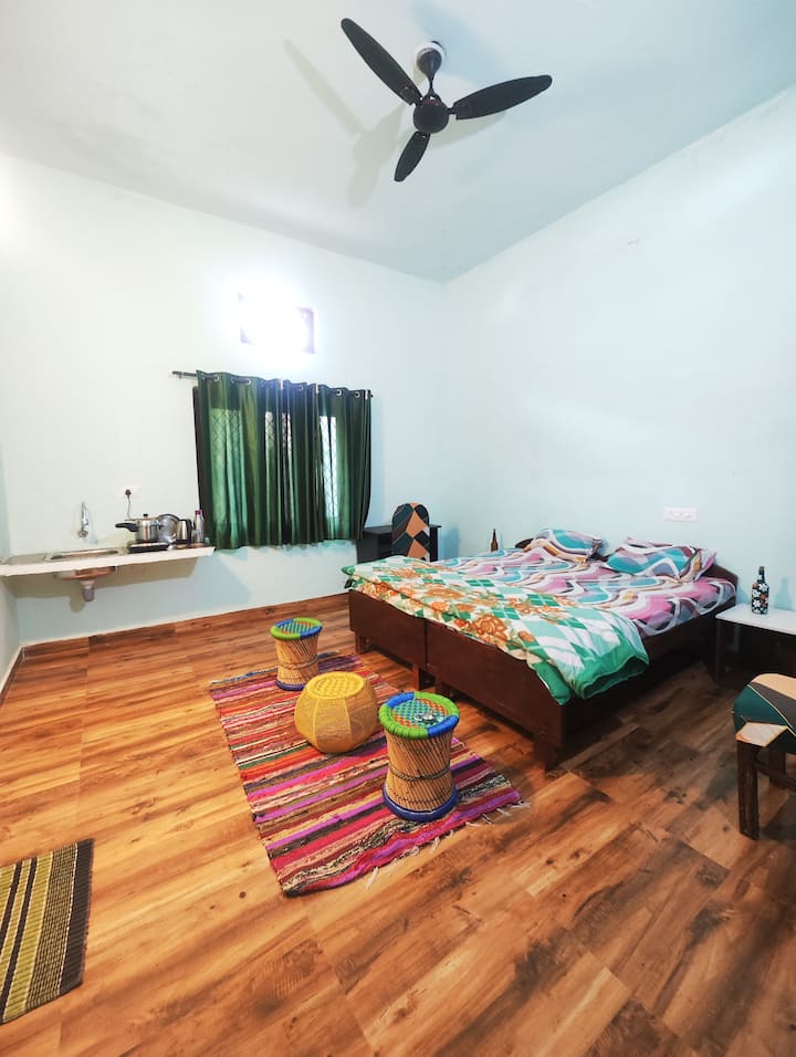 Bedroom with kitchenette at The Chimes House