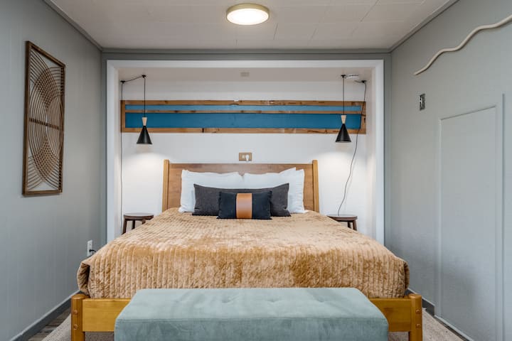Comfortable queen bedroom with a simple, relaxing feel.