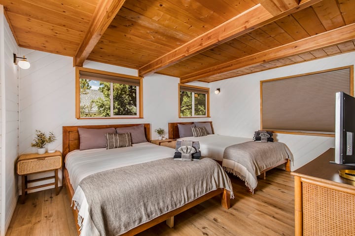 Spacious guest bedroom featuring two comfortable queen beds.
