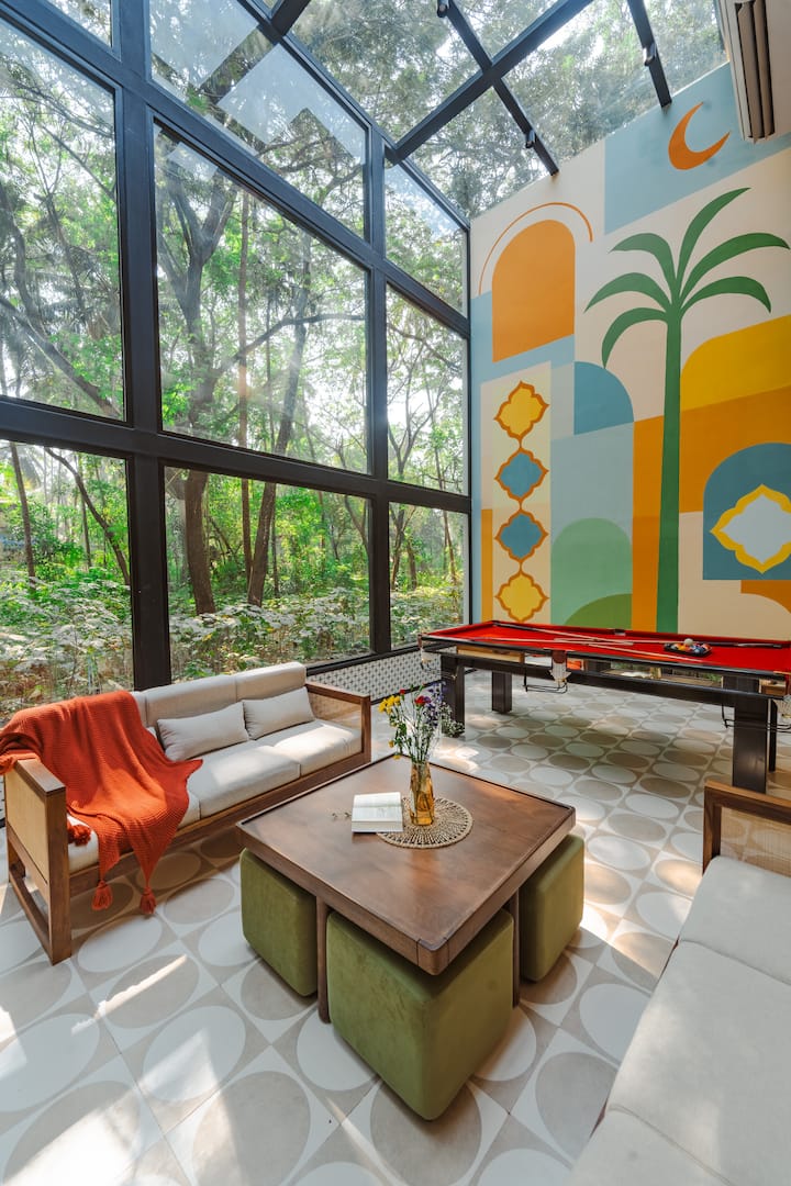 A serene 5BHK glass house amid lush Goan greenery