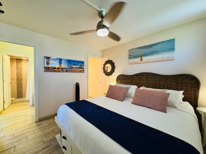Our master bedroom features a premium Tempur-Pedic King bed, private en-suite, and dual fans (ceiling + oscillating floor fan)  for a comfortable night's sleep