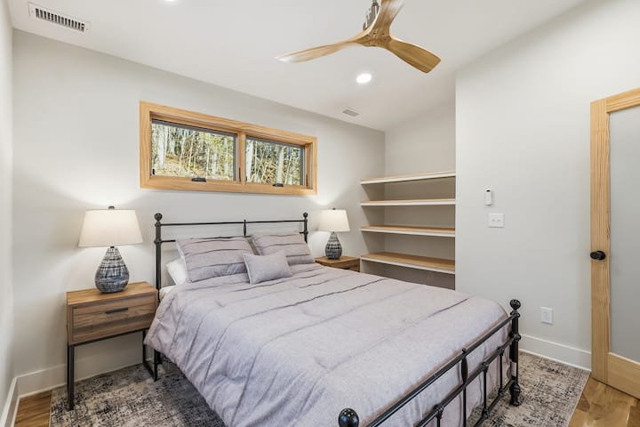 Relax in this cozy guest bedroom offering a quiet, comfortable place to recharge. Neutral tones and thoughtful details make it feel welcoming and restful for every guest.